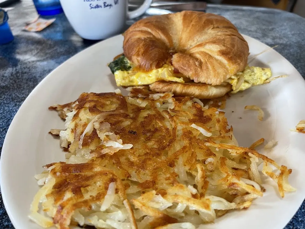 Croissant with Eggs Cheese and Spinach